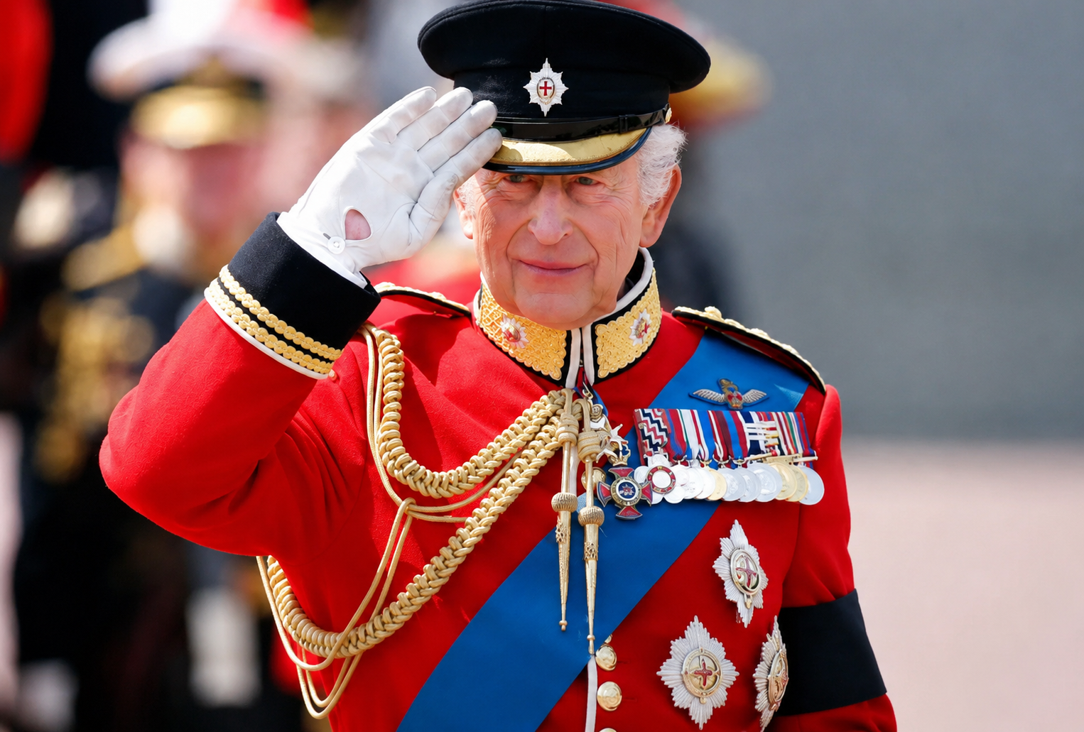 King Charles III salutes during a ceremonial event after revealing his tax bill in the annual Royal Household financial report.