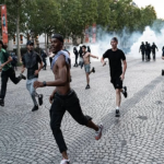 Champions League Riots in France as PSG fans clash with police in Paris after UEFA Champions League celebrations.