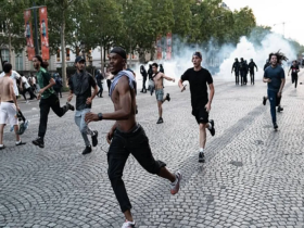 Champions League Riots in France as PSG fans clash with police in Paris after UEFA Champions League celebrations.